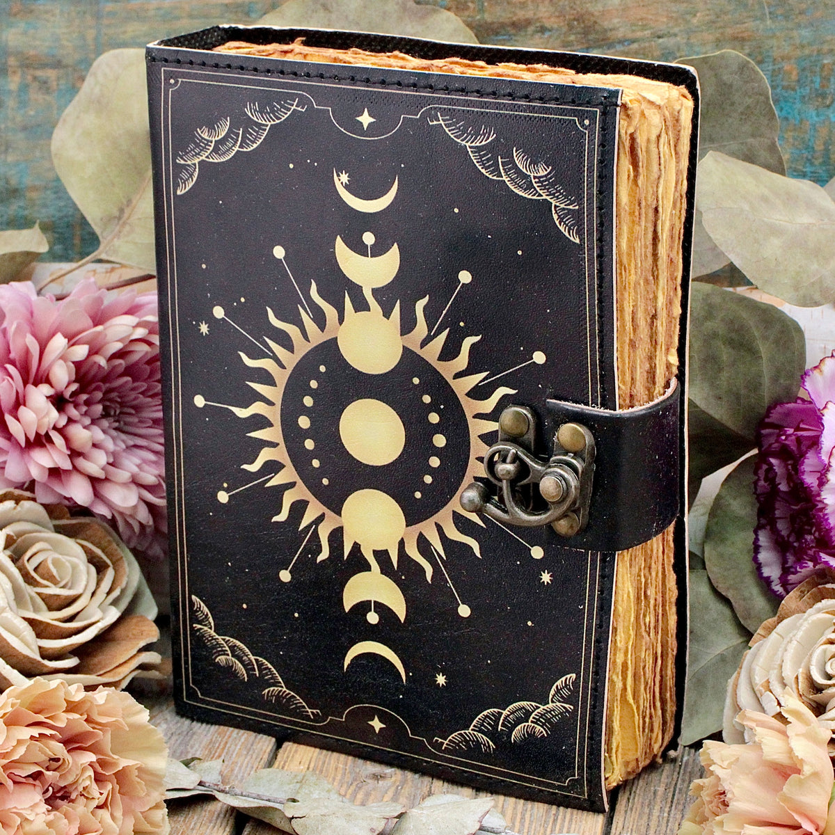 Celestial Moon Phase Leather Journal with aged blank pages and metal clasp