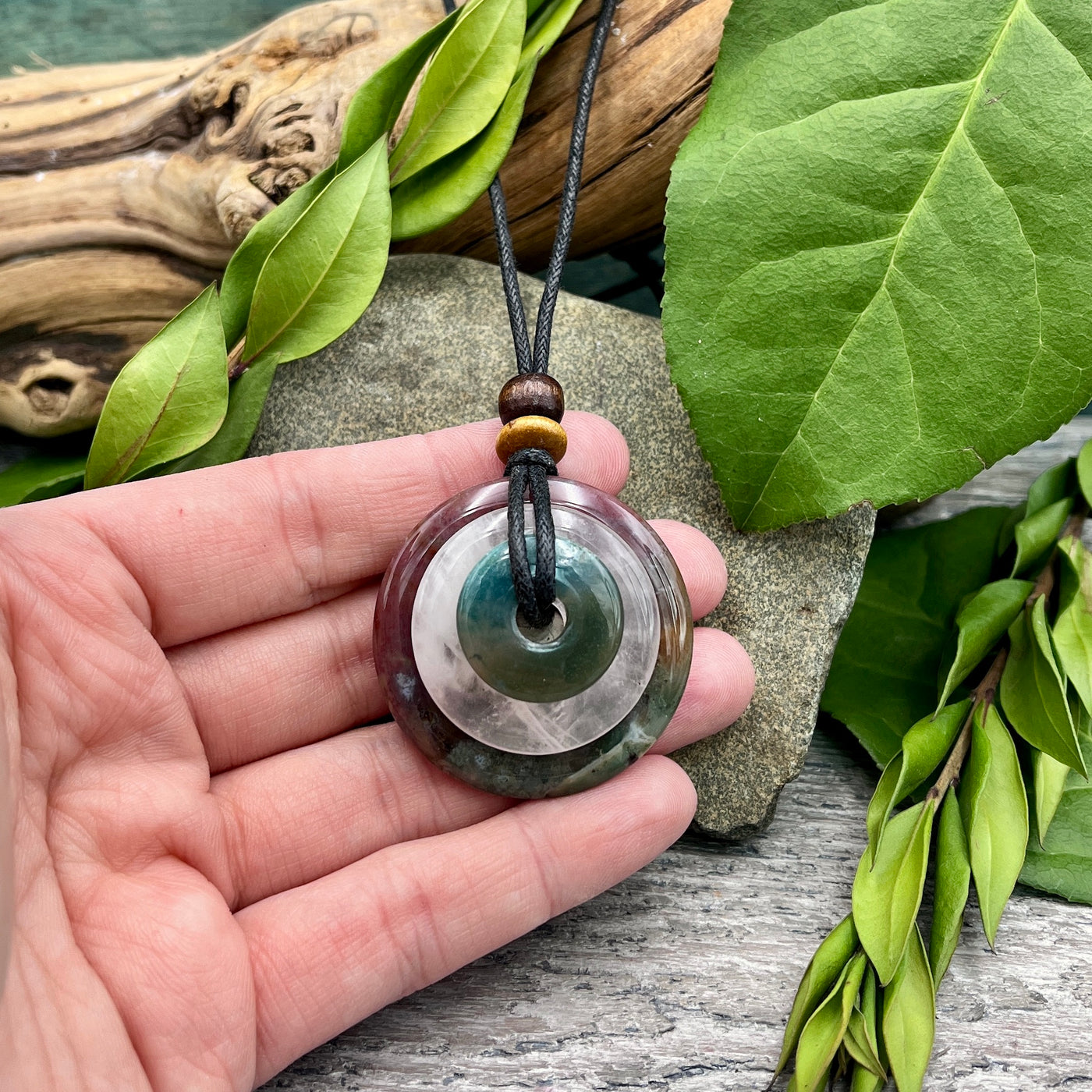 A Wonderful Life Circles of Power Necklace hand