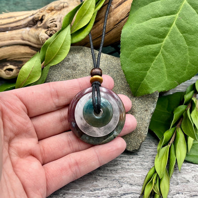 A Wonderful Life Circles of Power Necklace hand